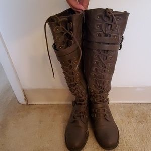 Knee high combat boots.